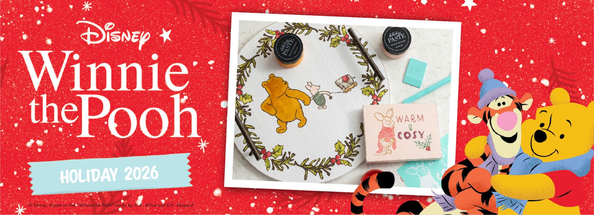 A festive Disney Winnie the Pooh holiday 2026 banner with Pooh and Tigger hugging, embroidery art, and holiday decorations on a red, snowy background.