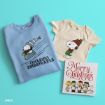 A folded blue sweatshirt and a small cream t-shirt with Snoopy prints, next to a “Merry Christmas” book featuring Peanuts characters, all on a turquoise background.