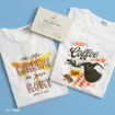 Two white t-shirts lay side by side. One reads “I’m the LORELAI to your RORY” with a yellow dragonfly. The other says “I NEED Coffee IN AN IV” with a coffee pot, cup, and checkered napkin. A coffee-themed card sits above.