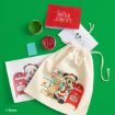 A festive Disney-themed gift set with Mickey Mouse art, two cards, two ink pads (green and red), and a beige drawstring bag featuring Mickey dressed as Santa, all on a bright green background.