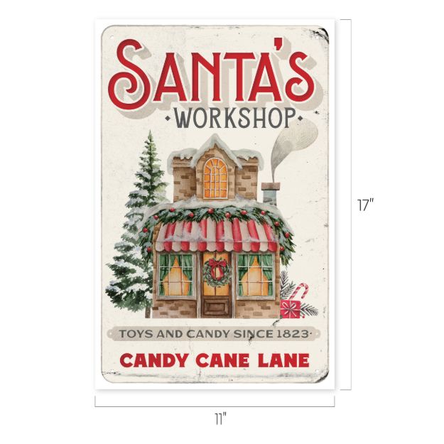Vintage-style sign reading “Santa’s Workshop” with a festive house, candy canes, wreath, and garland. Text: “Toys and Candy Since 1823” and “Candy Cane Lane.” Sign is 11″ wide by 17″ tall.