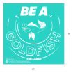 Turquoise square with white text: “BE A GOLDFISH.” Illustration of a goldfish blowing bubbles is in the center. The bottom features the “Ted Lasso” logo. Image dimensions are 9 inches by 9 inches.