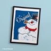 Framed print of Frosty the Snowman with the text “The Original” on a blue background.