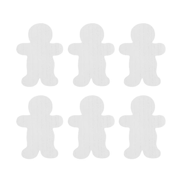 Six identical white gingerbread man cutouts arranged in two rows.