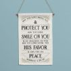 Canvas wall hanging printed with the Bible verse Numbers 6:24-26, “The Lord bless you and protect you; the Lord smile on you and be gracious to you; the Lord show you his favor and give you his peace.”